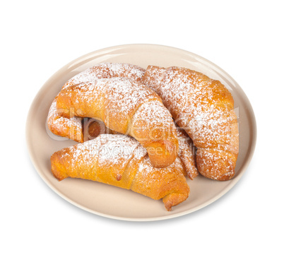 Freshly baked croissants on a white background