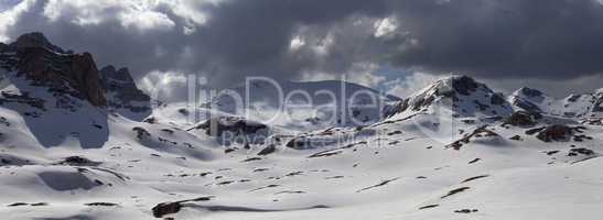 Panorama of snowy mountains before storm