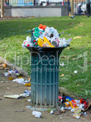 Trash basket full in park