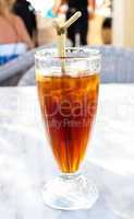 Cold iced tea with straw