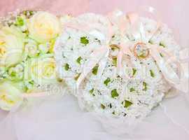 Wedding ornaments, ring on pillow in shape of heart