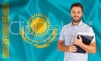 Male student of languages ??on Kazakhstan flag