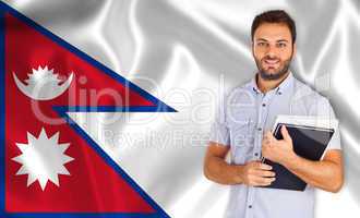 Male student of languages ??on Nepal flag