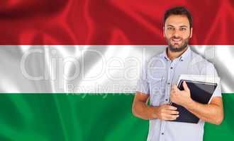 Male student of languages ??on Hungarian flag