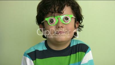 little boy with funny glasses