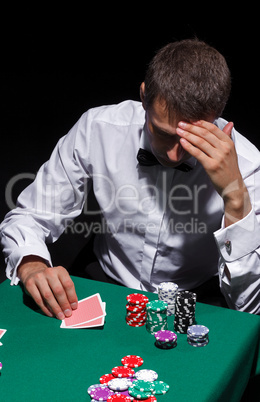 Gentleman in white shirt, playing cards