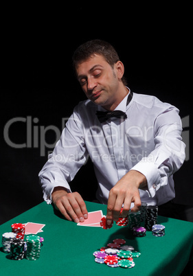 Gentleman in white shirt, playing cards
