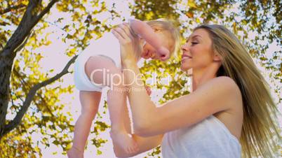 Loving Mother with her Baby Outdoors