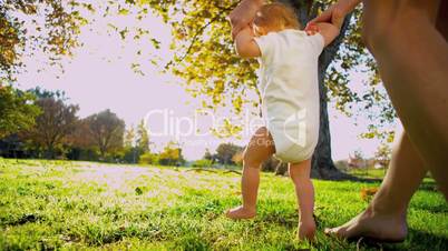 Blonde Young Child Taking First Steps