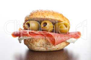 Sandwich with ham and olives with mozzarella