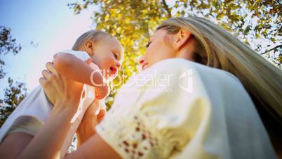 Caucasian Mother and Baby Laughing Together