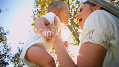 Blonde Mom and Baby Tender Kiss