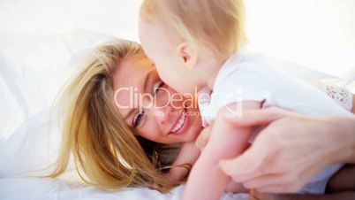 Blonde Mom and Baby Tender Kiss