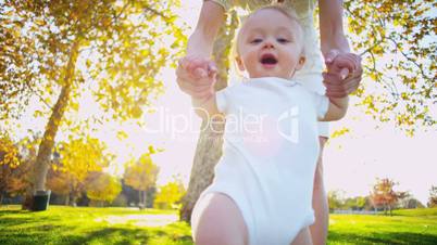 Cute Young Child Taking First Steps