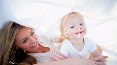 Blonde Mom and Baby Playing Indoors