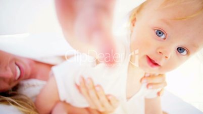 Laughing Young Mother and Baby