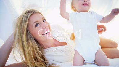 Caucasian Mother and Baby Laughing Together