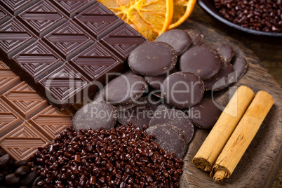 chocolate with sliced dried orange and cinnamon sticks
