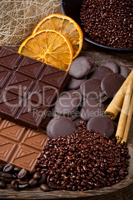 chocolate with sliced dried orange and cinnamon sticks