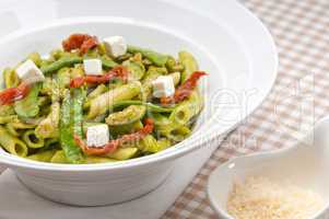 Italian penne pasta with sundried tomato and basil