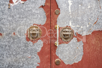 lion door handles in a beijing hutong