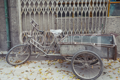 weathered bike parked in beijing