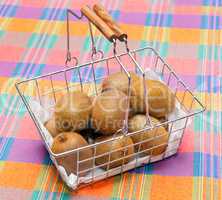 basket of kiwi on tablecloth