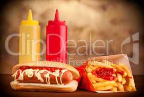 fresh and tasty hot dog with fried potatoes
