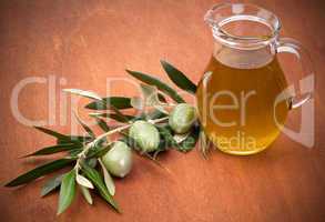 Olives and a bottle of olive oil