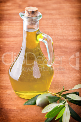 Olives and a bottle of olive oil