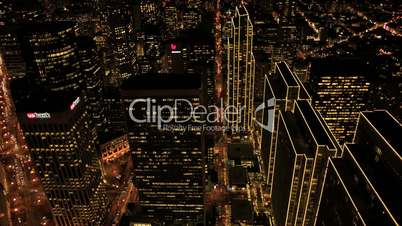 Aerial night view of illuminated city skyscrapers, USA