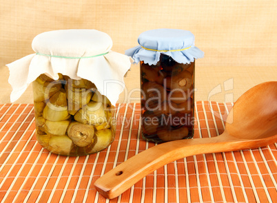 Jars with artichokes and onions in oil