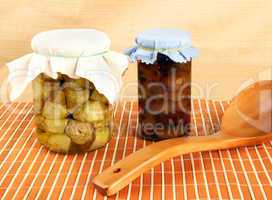 Jars with artichokes and onions in oil