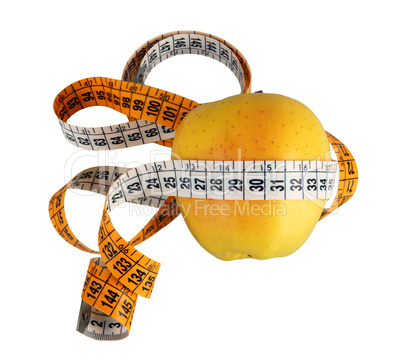 Diet concept with green apple wrapped with measuring tape