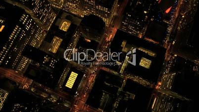 Aerial night vertical rooftop view of city skyscrapers, USA