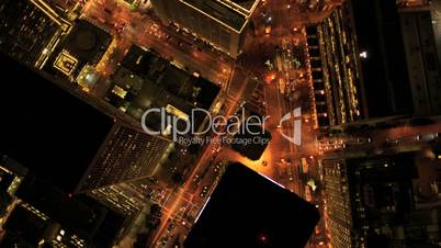 Aerial vertical view at night of city traffic illuminated by city streets, USA