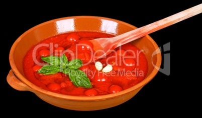 Bowl with tomato sauce