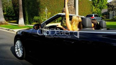 Pretty Girlfriends Enjoying Driving a Convertible