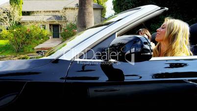 Girls Driving by Luxury Homes California