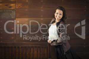 Mixed Race Young Adult Woman Portrait Against Wooden Wall