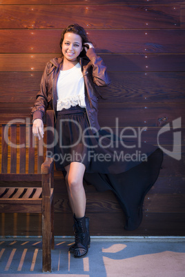 Mixed Race Young Adult Woman Portrait Against Wooden Wall