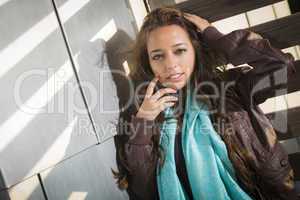 Mixed Race Young Adult Woman Against a Wood and Metal Wall