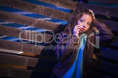 Frightened Pretty Young Woman in Dark Walkway at Night