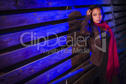 Mixed Race Young Adult Woman Against a Wood Wall Background