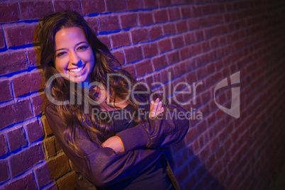 Pretty Mixed Race Young Adult Woman Against a Brick Wall