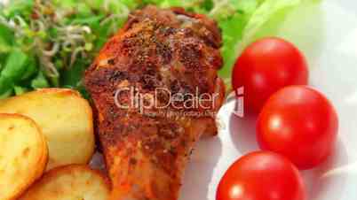 Roasted chicken leg with potatos sprouts salad and tomatoes dolly shot