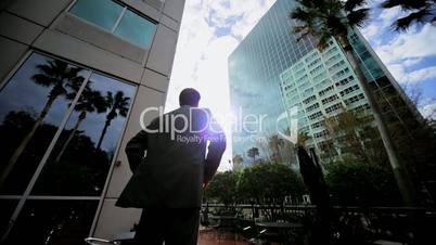 Satisfied Business Leader Outside Downtown Skyscrapers