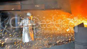 mill worker with hot steel