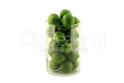 Key Limes in Glass Cylinder on white.
