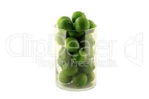 Key Limes in Glass Cylinder on white.